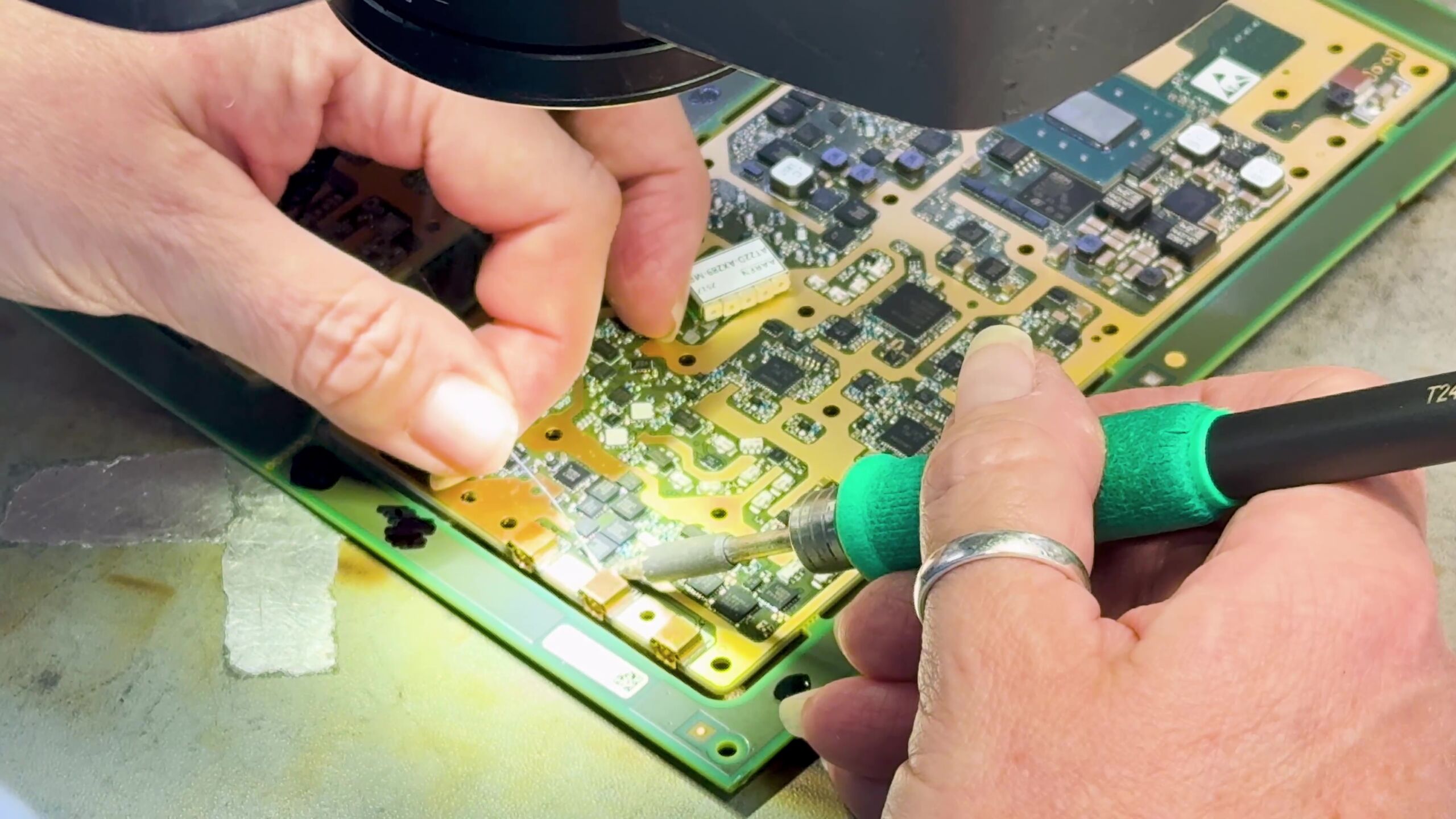 Soldering a component onto a board at Brynleigh Technology.